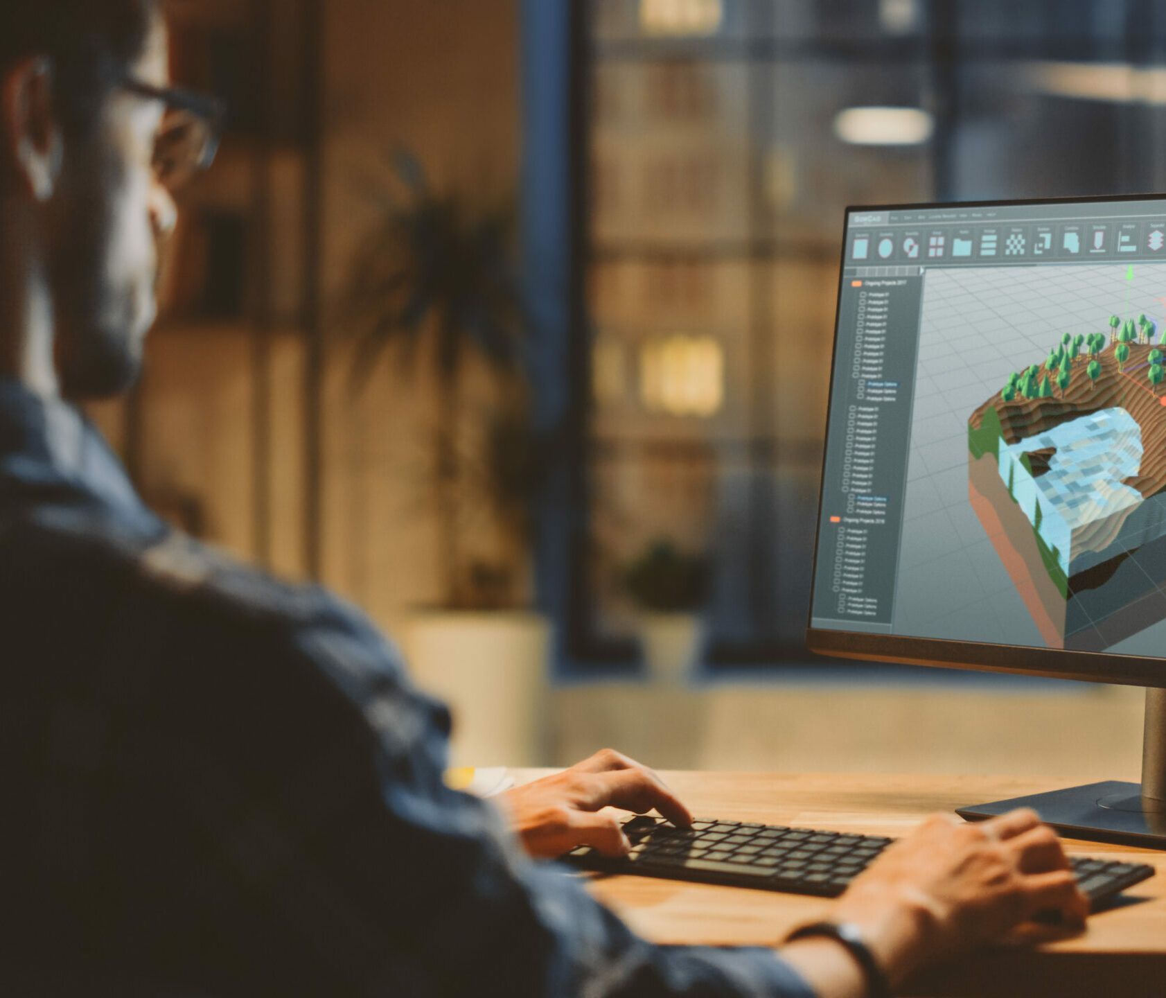 In the Evening Creative Young Video Game Developer Works on a De